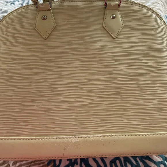 Authentic Louis Vuitton Ivory Epi Alma Textured Leather Bag - Picture 5 of 15